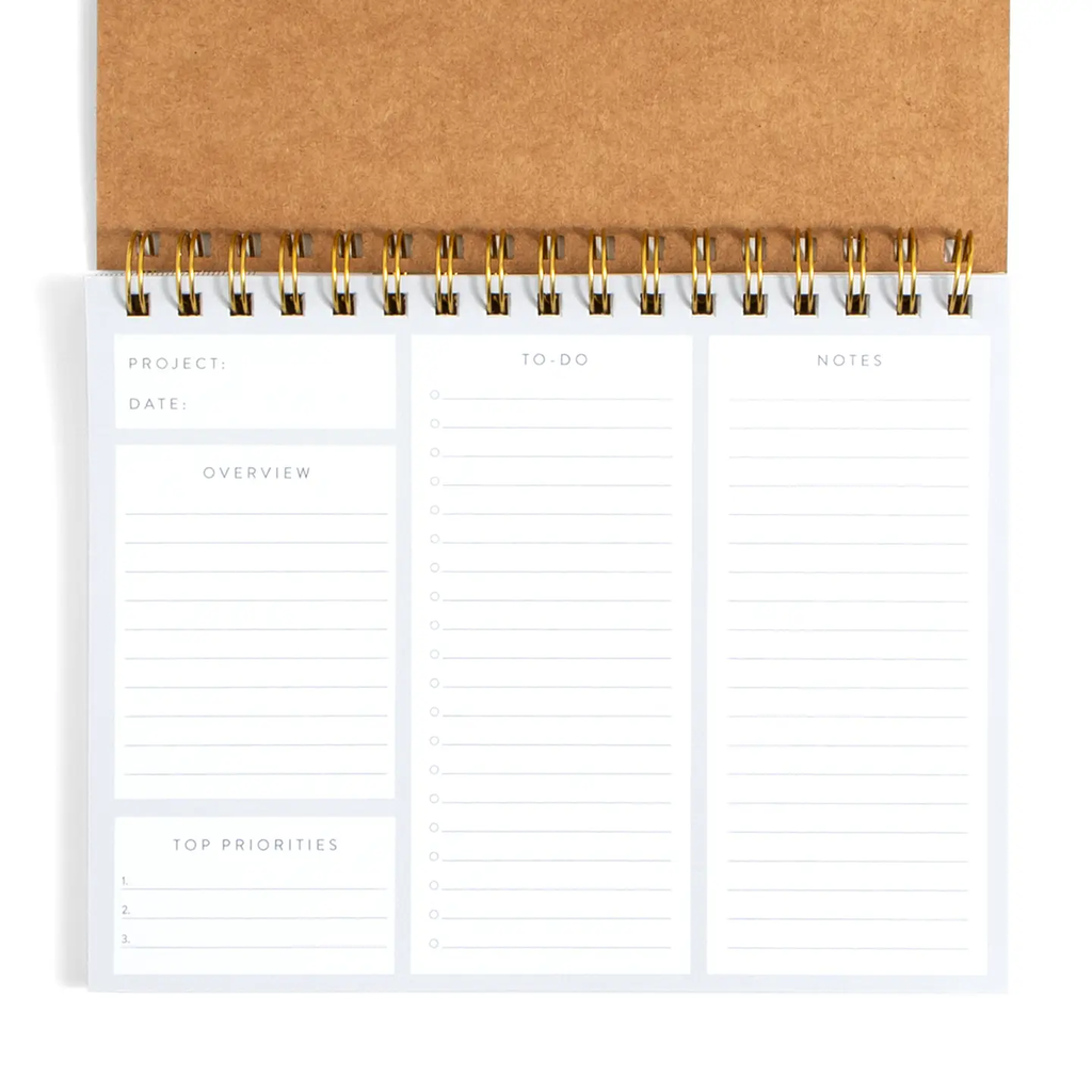 Undated spiral project planner open showing structured layout with Project, Date, Overview, To-Do checklist, Notes, and Top Priorities columns